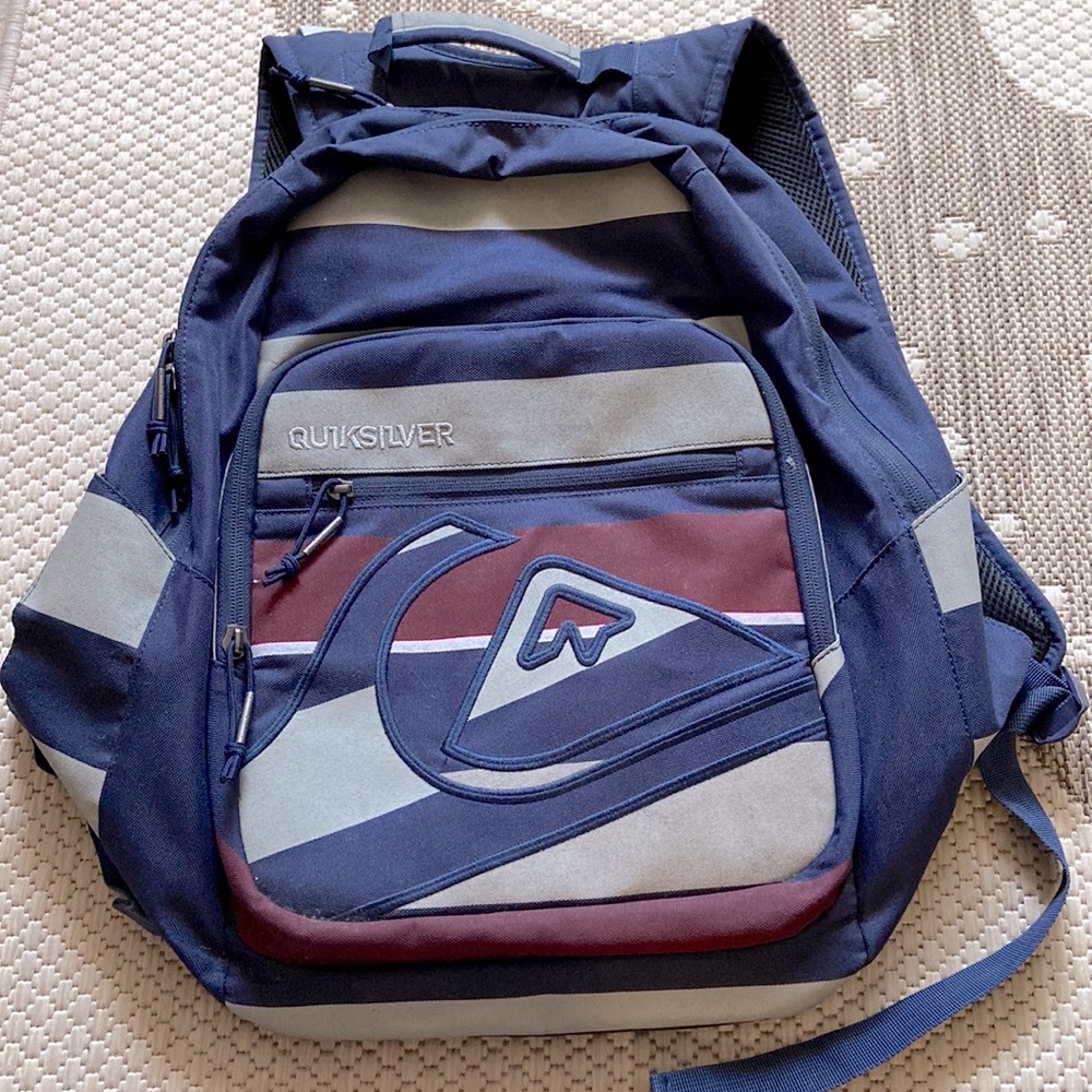 Quicksilver backpack. Navy blue with gray and burgundy. New without tags.